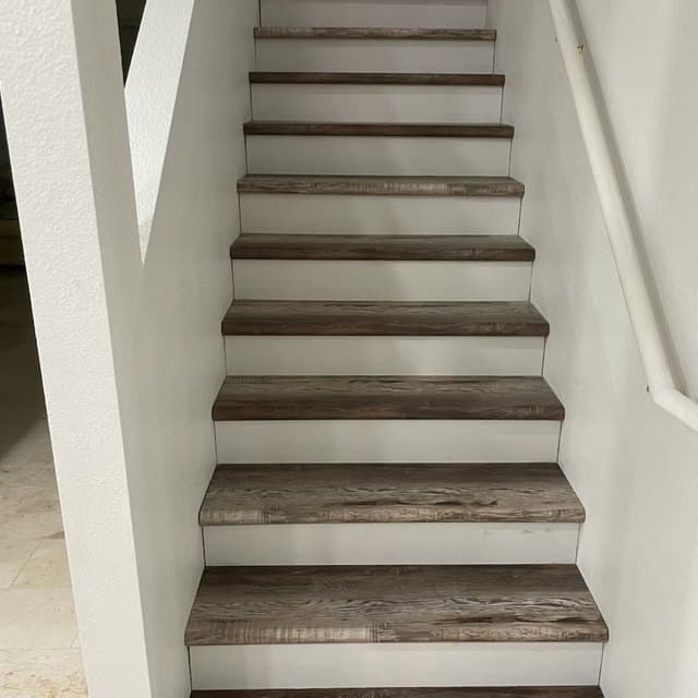 Staircase refinished with timber effect treads and white risers